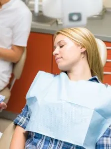 A woman asleep in the dental chair